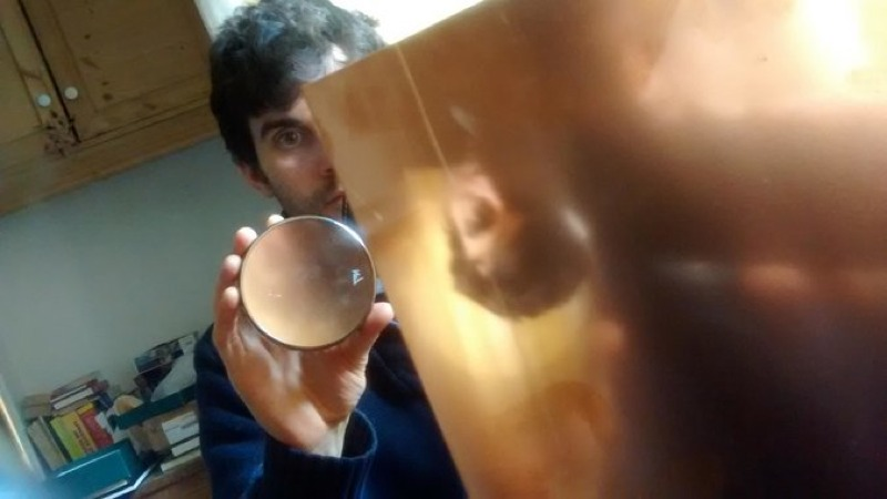 Francis O’Neill demonstrates how lenses could be used to project an image on a copper surface. (Image: Francis O’Neill)